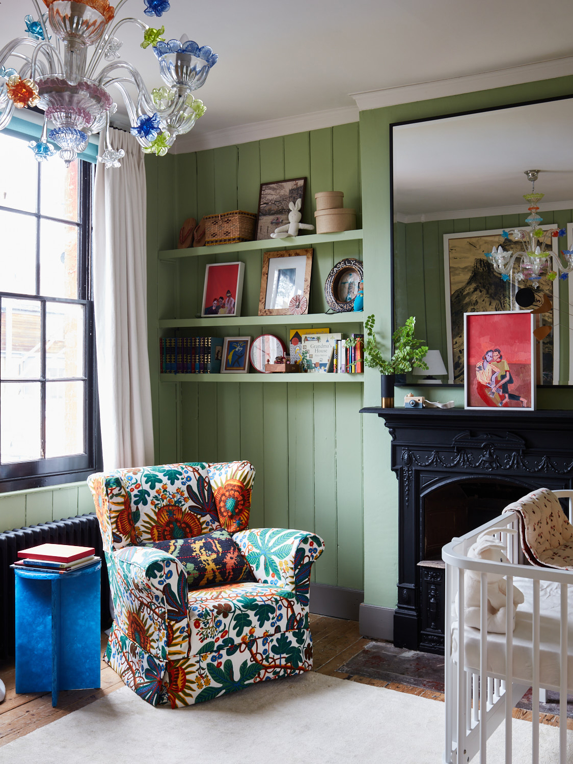 sage green nursery with botanical chair